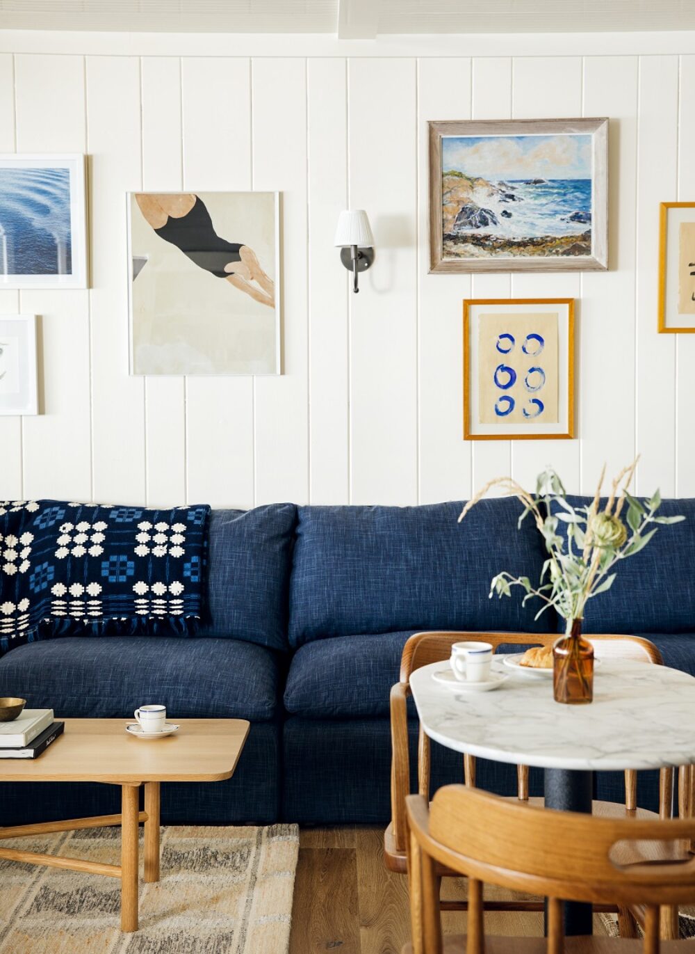 A seating area in the hotel lobby with a blue sofa.