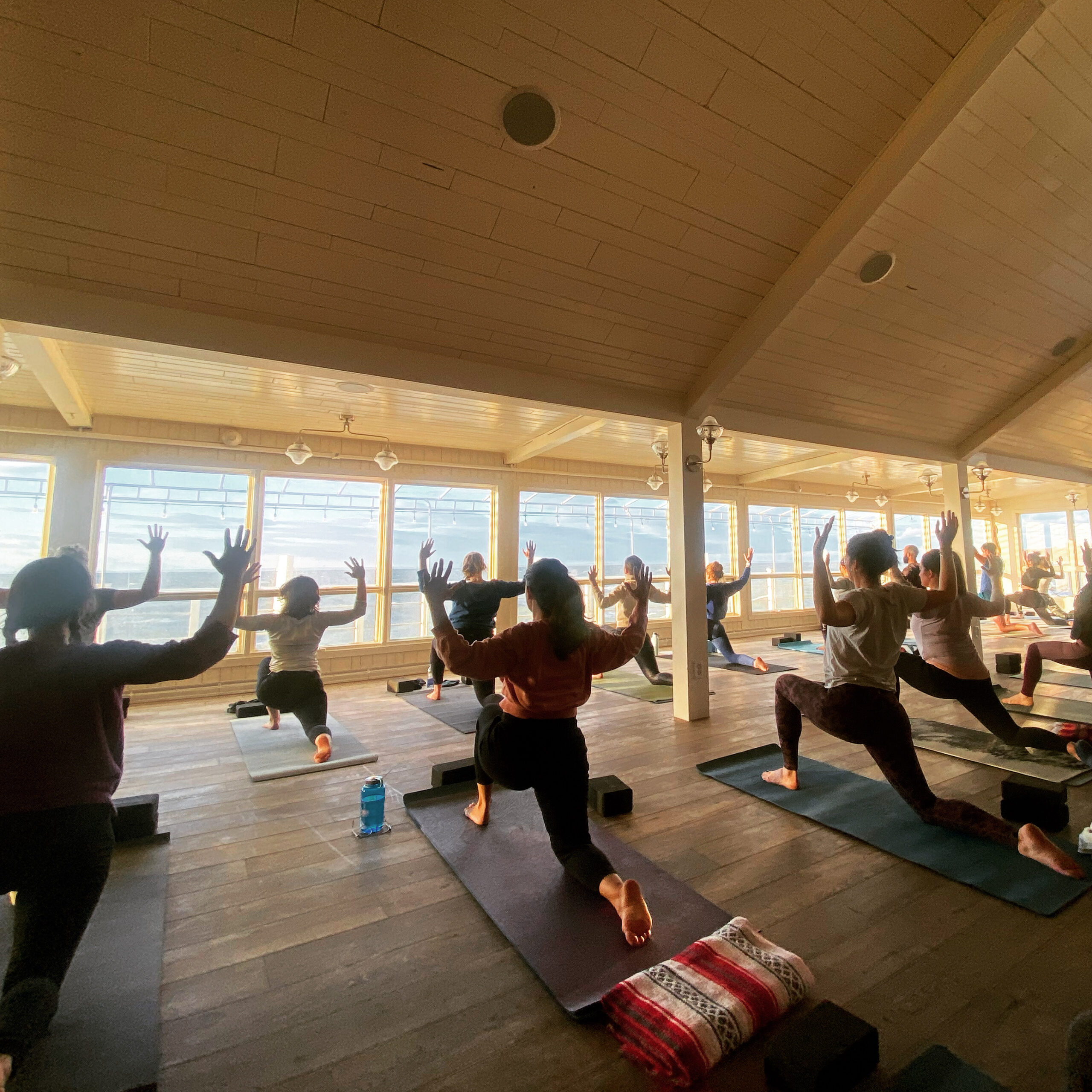group yoga session with ocean view