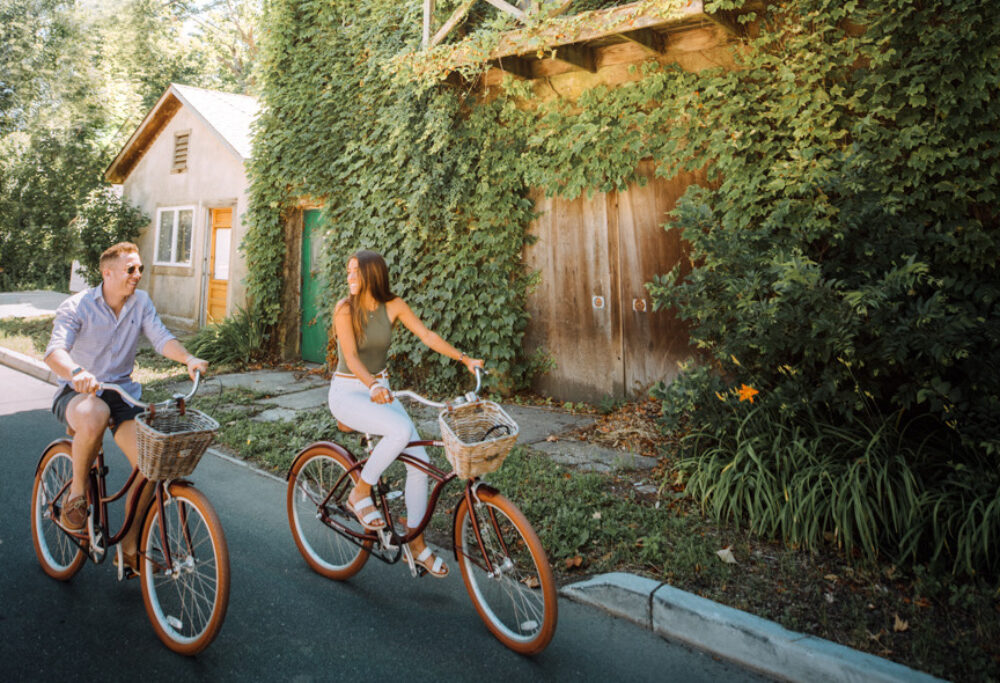 couple bike riding through Greenport