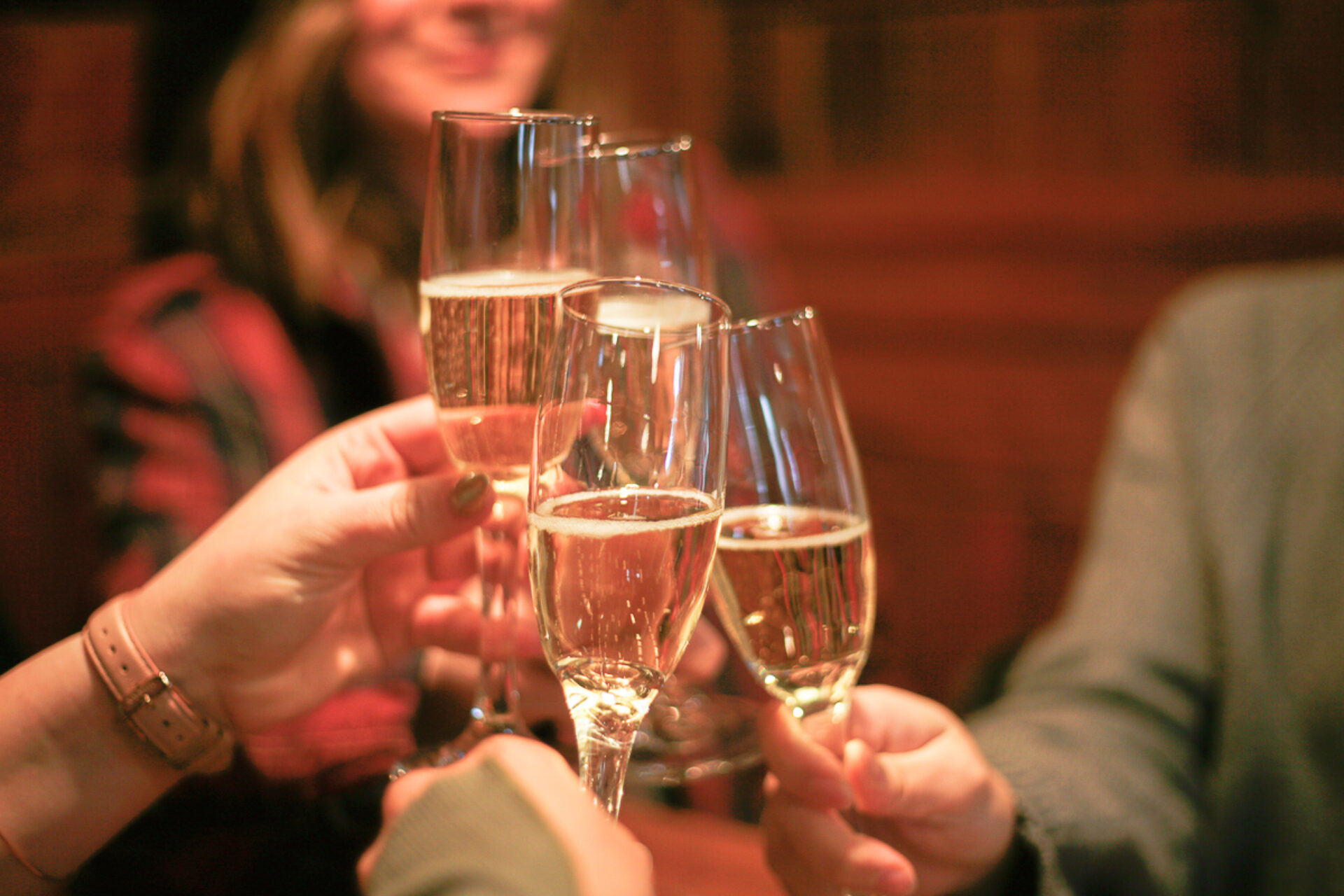 Friends toasting champagne glasses.