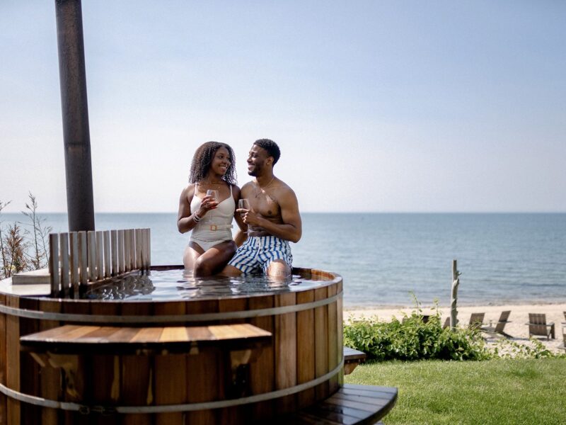 couple in hot tub on the beach