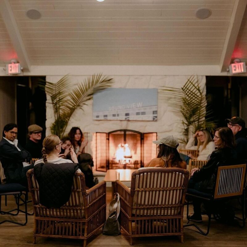 A fireside chat in the hotel lobby.