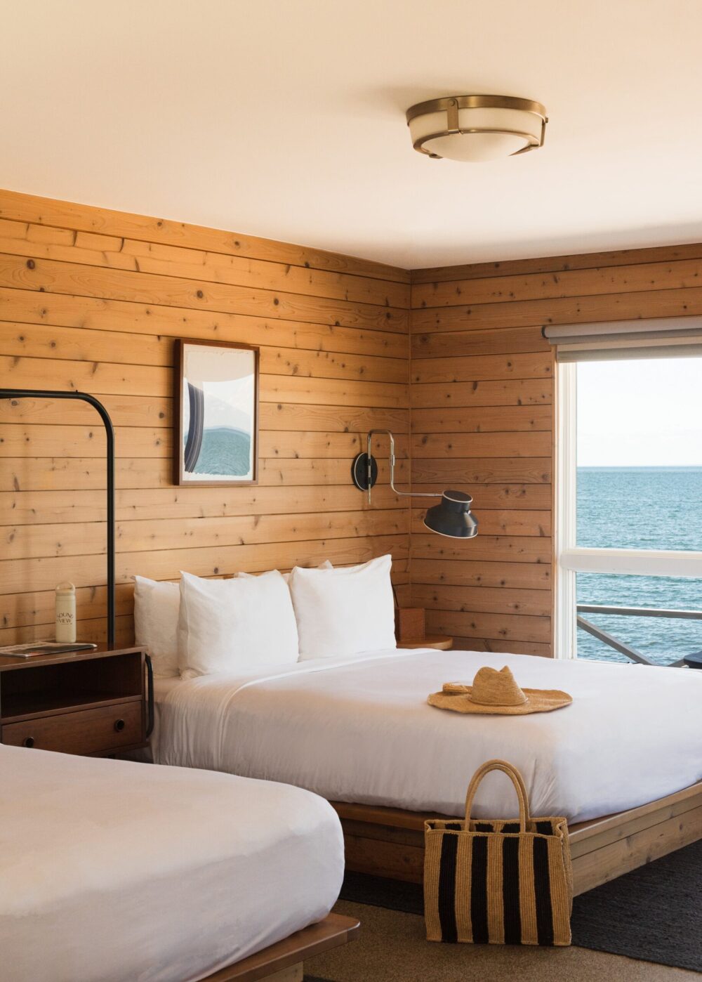 room with two beds and ocean view