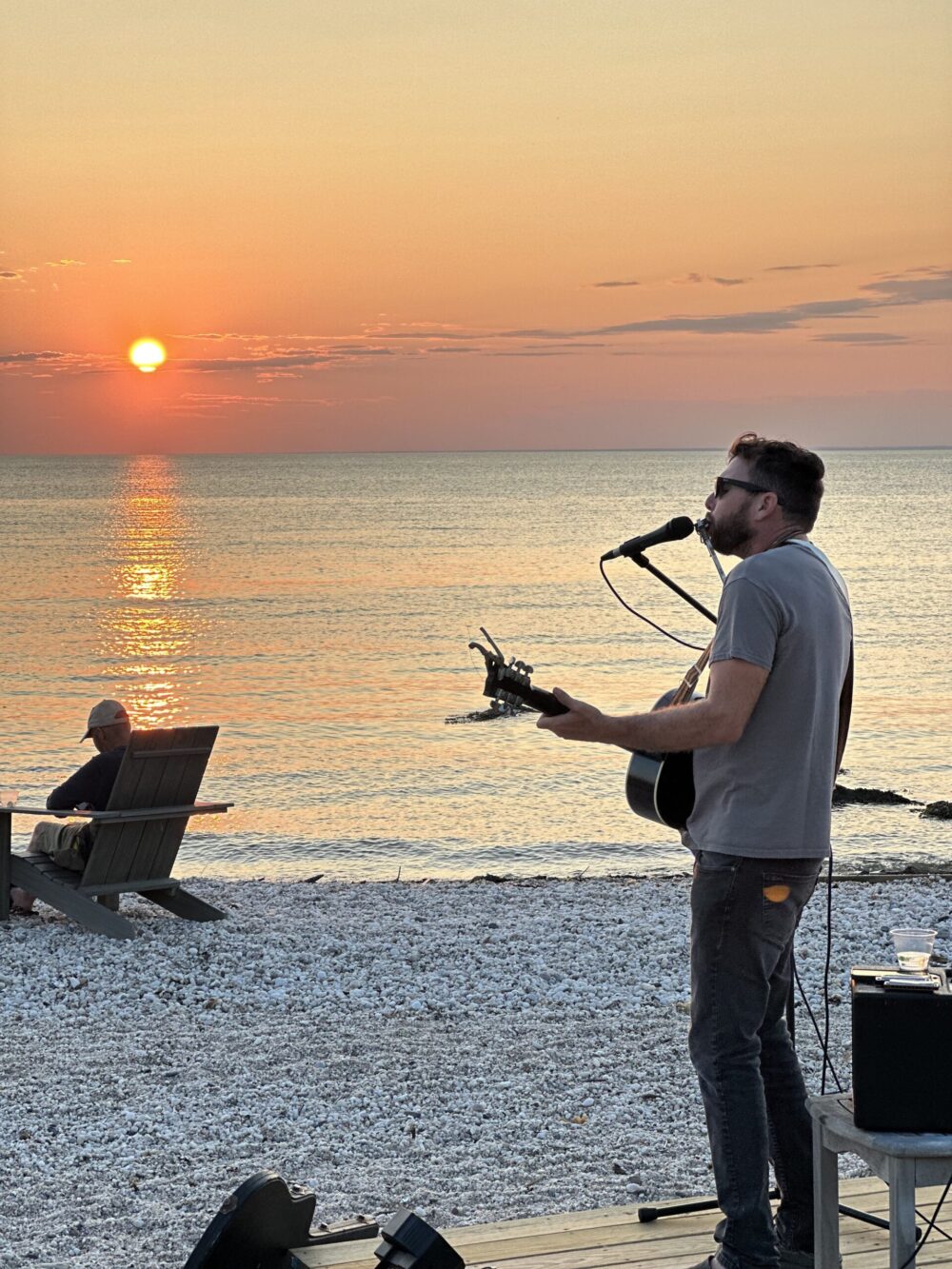 Job Divello singing on the North Folk beach at sunset.