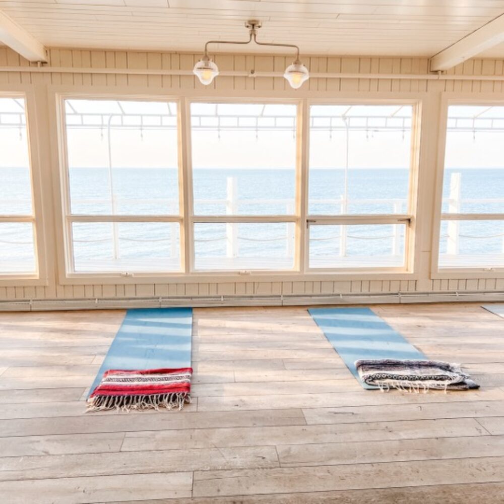 Yoga mats on the floor with blankets.