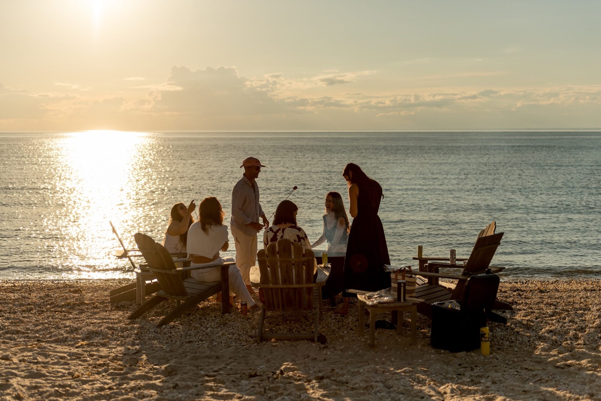 Friends by the beach, at sunset.