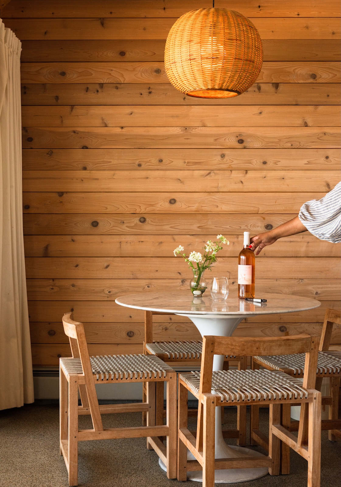 A bottle of rosé on a table in a suite at Sound View Greenport.
