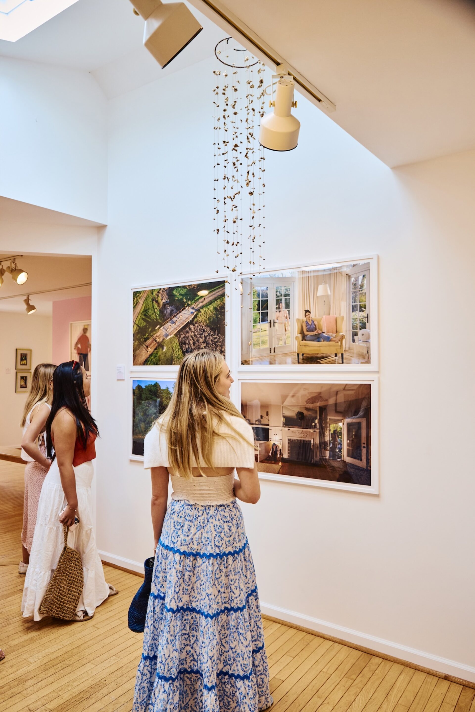 People walking around a gallery.