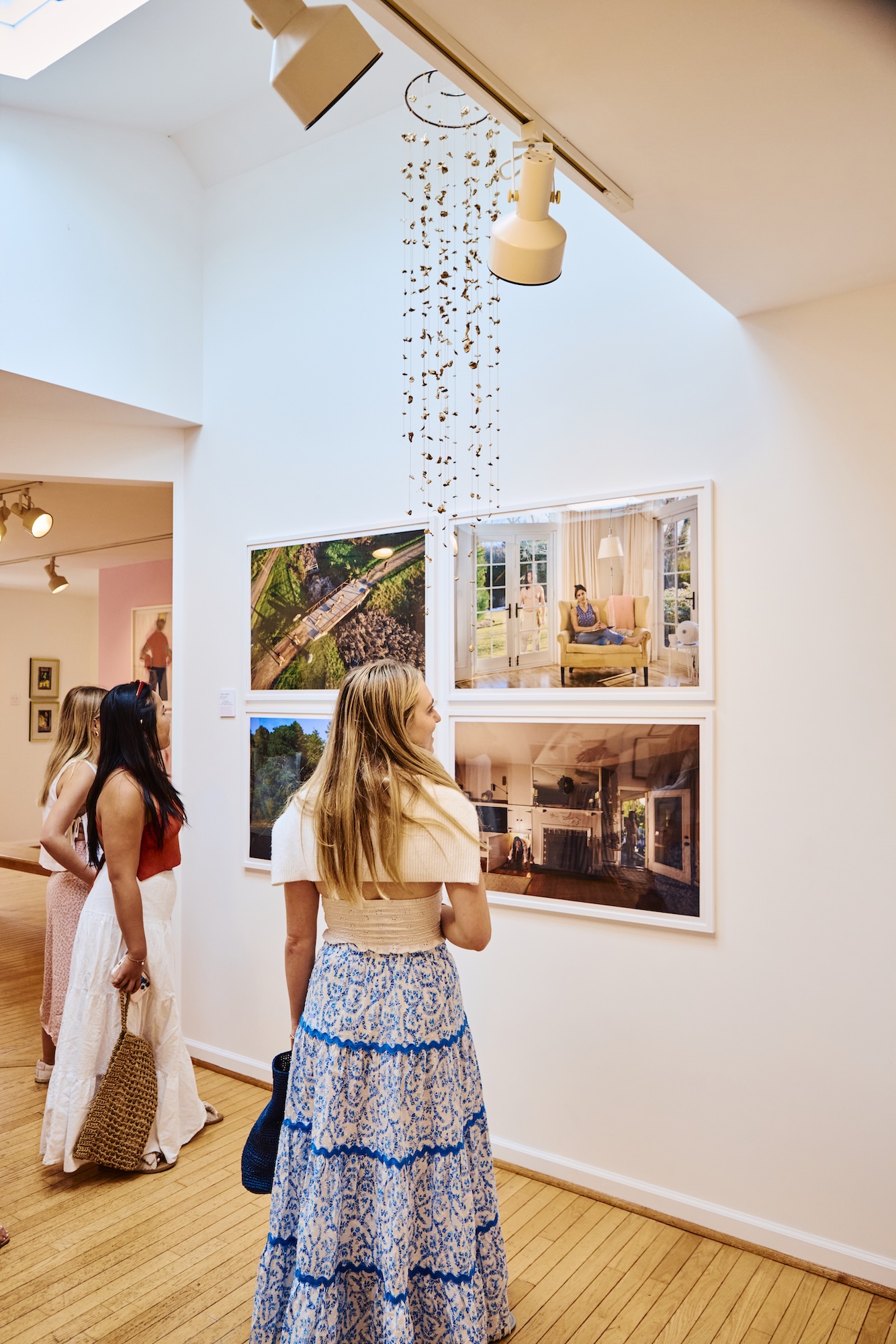People walking around a gallery.