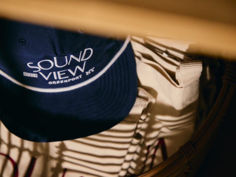 A navy baseball hat with Sound View Greenport logo in white.