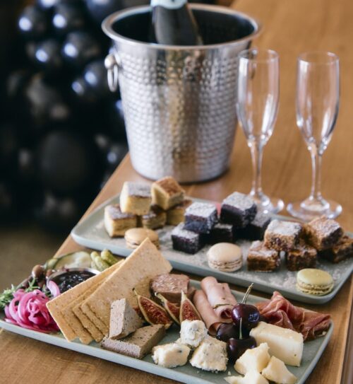 Assorted charcuterie and cookie trays in a guest room at Sound View Greenport.